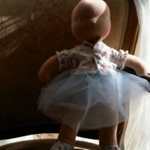 A bald doll by Louie Louie Bebe Waldorf doll