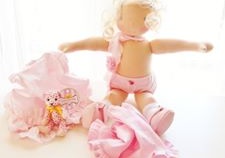 A pink ballerina Waldorf doll by Louie Louie Bebe